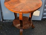 a round table with a wooden top and a wooden base