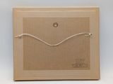a brown box with a string on the inside of it