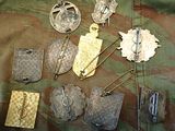 a lot of metal items that are laying out on a cloth