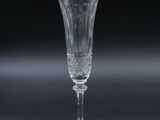 a close up of a wine glass on a black surface
