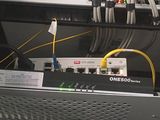 a bunch of cables connected to a computer in a room