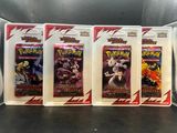 four packs of pokemon trading cards on display on a table