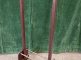 an image of a wooden rack with a green curtain in the background