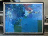a painting that is sitting on the floor in front of a tv