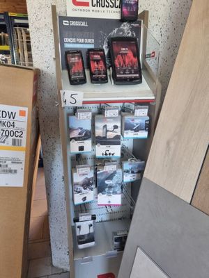 a display of cell phones in a store next to a cardboard box