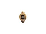 a close up of a black and gold ring on a white background