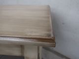 a small table with a wooden top and metal legs