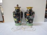 two vases that are sitting on a white table