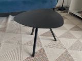 a black table with a black top sitting on a carpet