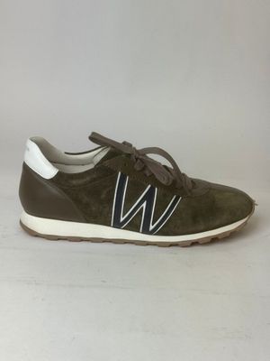 a pair of green sneakers with white stripes on the side