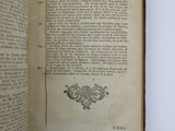an open book with a picture of a bird on it