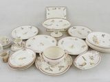 a lot of plates and cups on the table