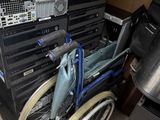 a wheel chair that has a bunch of equipment in it