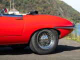 a red sports car parked on the side of the road
