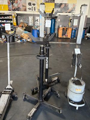 a picture of a garage with a lot of tools on the floor