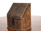 a small box sitting on a table with a white background