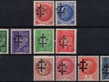several different colored stamps with crosses on them on a black surface