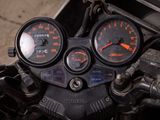 a close up of a motorcycle with a speedometer and gauges on it