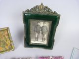 a picture of a man and a woman standing next to a picture frame