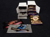 several packs of magic the gathering cards are sitting on a table