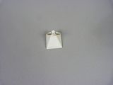 a small piece of paper with a ring on top of it