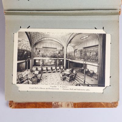 an old photo of a room with a fireplace and a couch