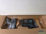 a box with a gun inside of it on the floor