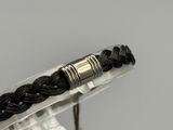 a close up of a bracelet with a metal clasp on it