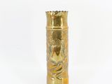 gold vase with a dragon design on it on a white background