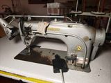 a sewing machine that is sitting on a table
