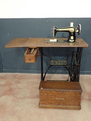 an old sewing machine sitting on a table in a room