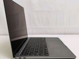 a laptop computer sitting on top of a white table