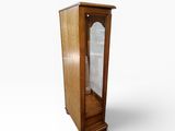 a small wooden cabinet with a glass door on it
