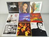 the album covers of various albums are displayed on a table