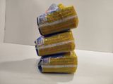 a stack of three bags of food sitting on a counter