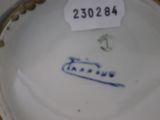 a close up of a plate with a name on it