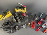 a lot of toy vehicles that are sitting on a table