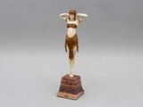 an image of a statue of a woman on a pedestal