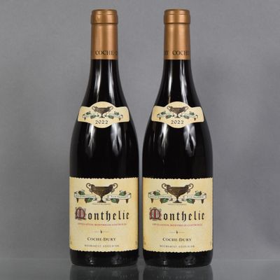 two bottles of wine sitting next to each other on a table