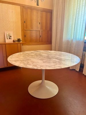 a marble table in the middle of a living room