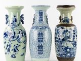 three blue and white vases sitting next to each other