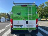 a van that is parked on the side of the road