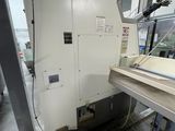 a machine that is sitting in a room with a lot of windows