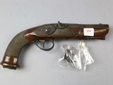 an old gun that is sitting on top of a table
