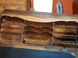 an old wooden desk with drawers and drawers in it