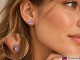 the woman is wearing a pair of earrings with purple stones