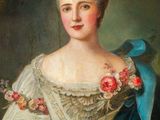 portrait of a lady in a blue dress with flowers in her hair