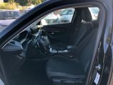 the interior of a car with the door open showing the driver ' s seat