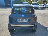 a small car that is parked in a parking lot