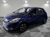 a blue car is parked in a room with a checkered floor